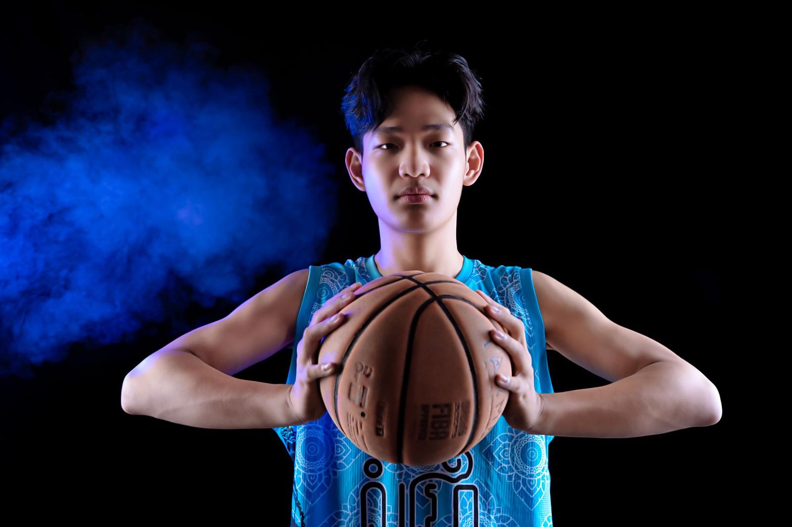 Young Player with Basketball